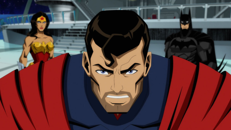 Superman angrily stares away from Wonder Woman and Batman