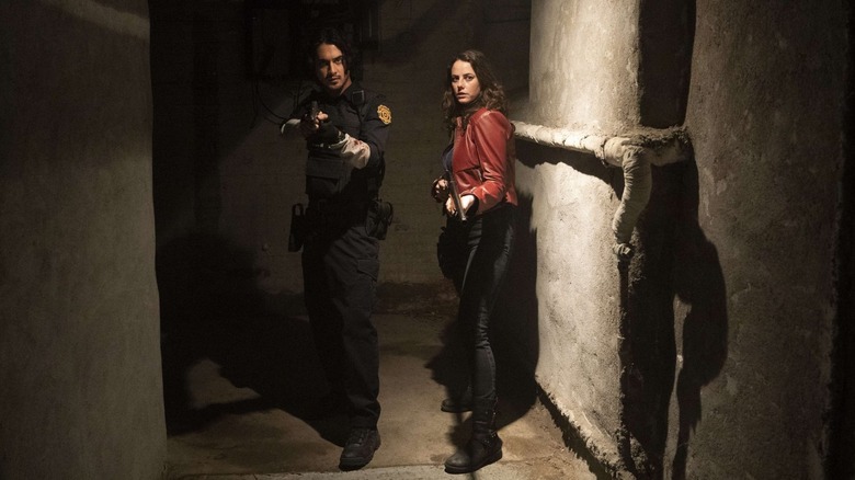 Leon Kennedy and Claire Redfield in a basement hallway