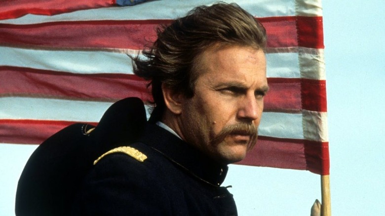 Kevin Koster in Dances With Wolves in front of American flag