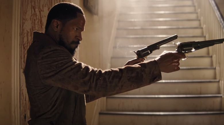 Jamie Foxx in Django Unchained aiming pistols