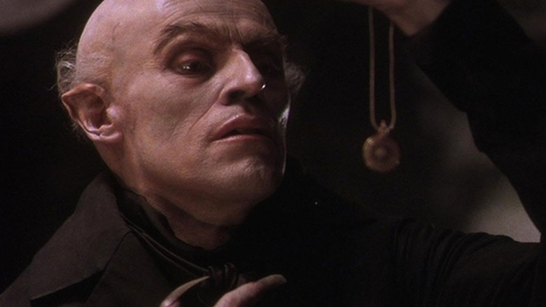 Count Orlok inspects an amulet