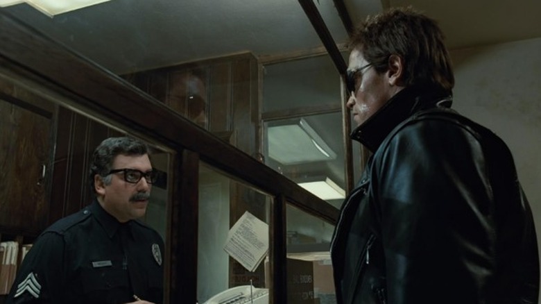 The Terminator talking with a cop in police station