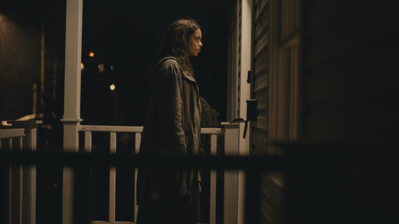 Georgina Campbell standing on porch in Barbarian