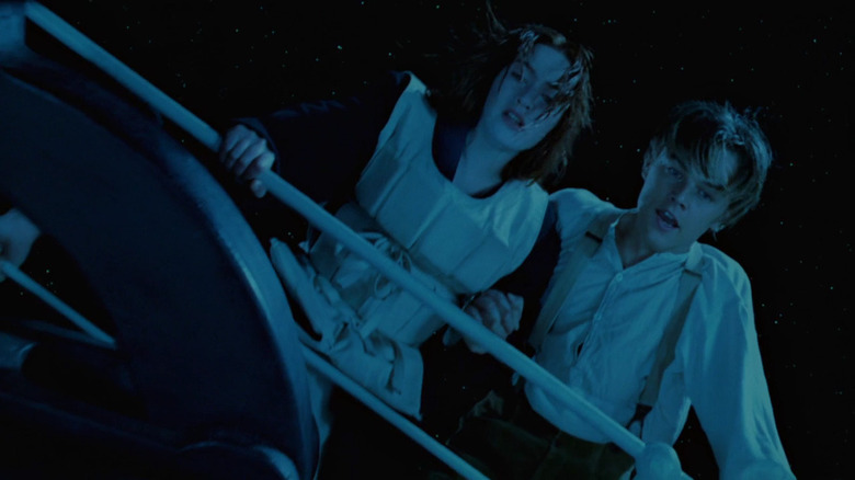 Titanic's Rose and Jack leaning over railing of boat