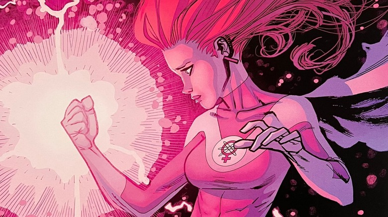 Atom Eve looking at her fist in pink light in the comic book Invincible