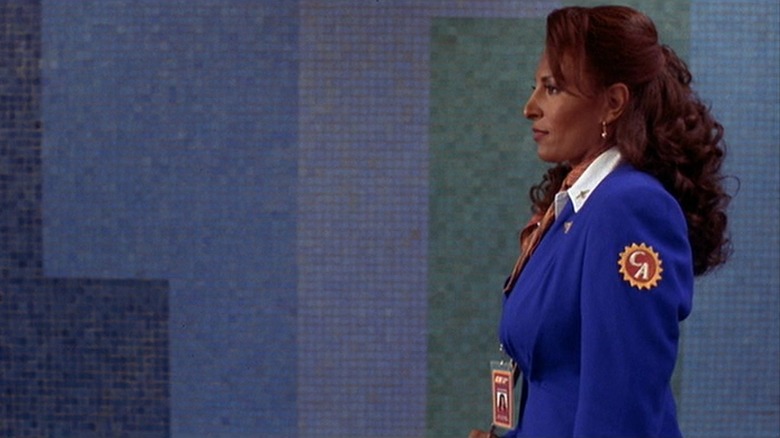 Pam Grier standing, side profile