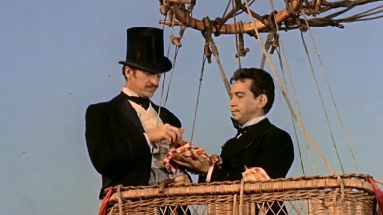 Passepartout offering food to Phileas Fogg in Around the World in 80 Days (1956)