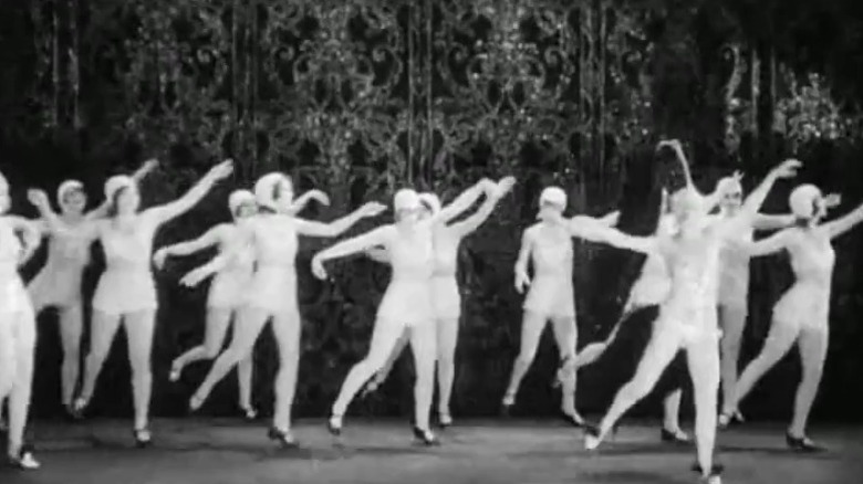 Female dancers lifting their feet together in The Broadway Melody