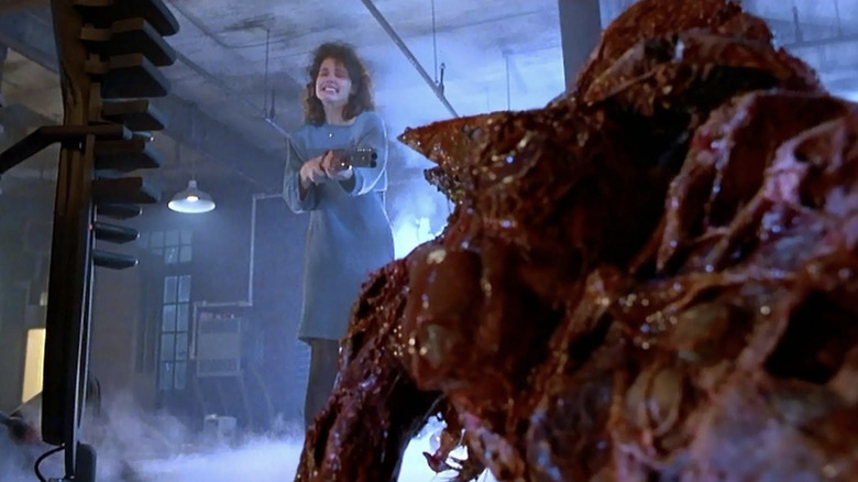 Geena Davis and the Brundlefly in The Fly