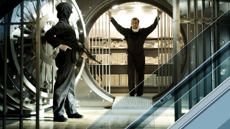 Clive Owen armed figure bank vault