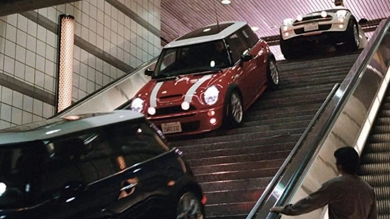 Mini Coopers driving down stairs