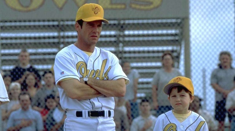 Jim standing next to his son on the field