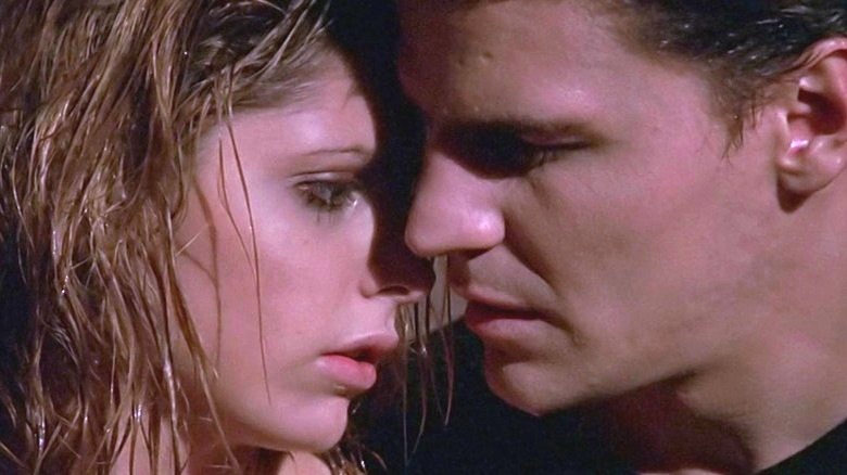 Buffy and Angel huddled close embrace