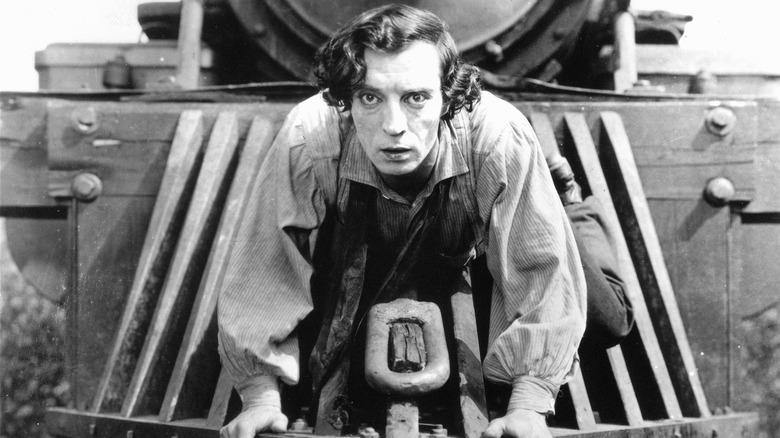 Buster Keaton on the front of a train