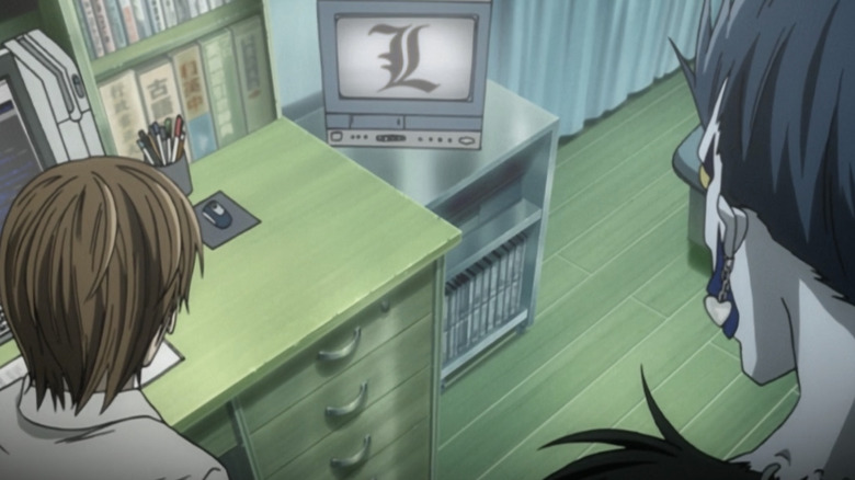 Light and Ryuk stare at the letter L