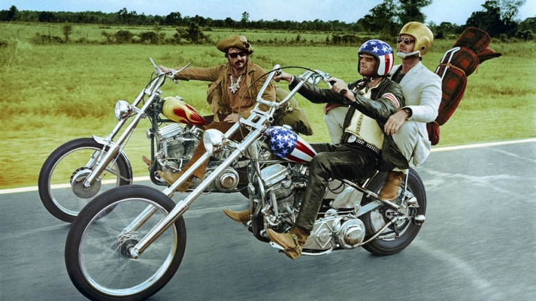 Three men riding motorcycles