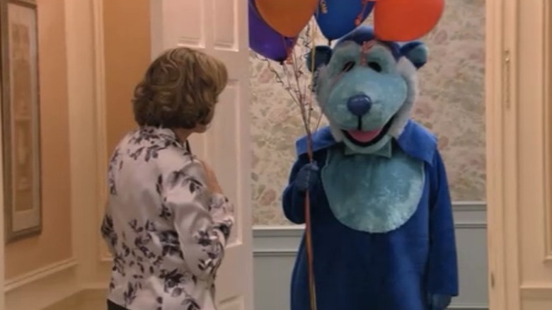 Lucille greets man in bear costume