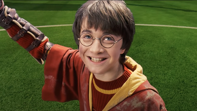 Harry holding snitch