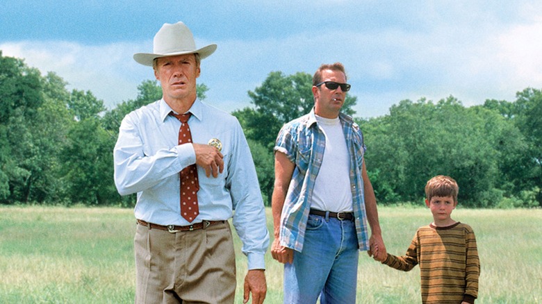 Red Garnett and Butch Haynes standing in a field