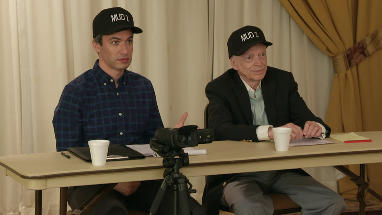 Nathan Fielder and Bill Heath sitting Nathan for You