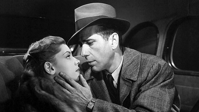 Lauren Bacall and Humphrey Bogart about to kiss in The Big Sleep