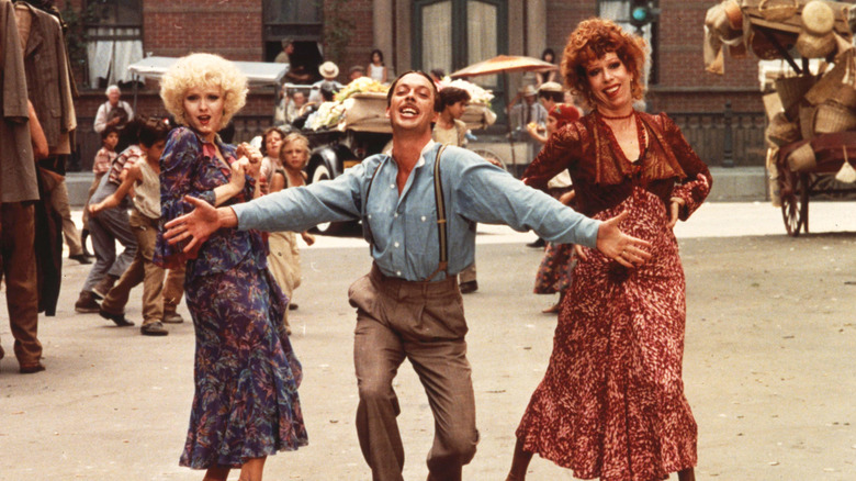 Peters, Curry, and Burnett dancing in street