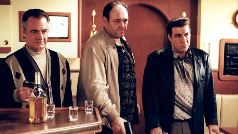 Paulie Gaultieri, Tony Soprano, and Silvio Dante holding guns