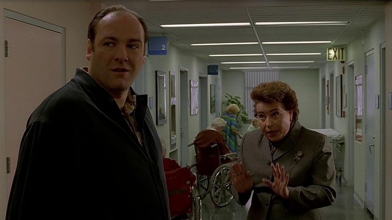 Tony Soprano standing in hospital hallway