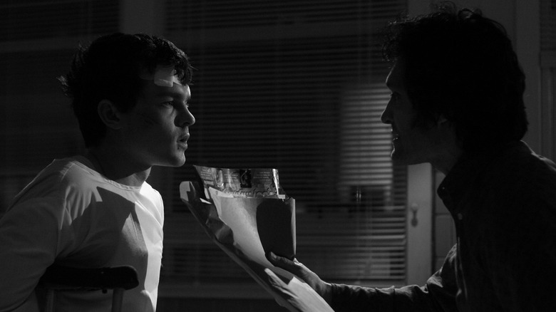 Alden Ehrenreich and Vincent Gallo in the shadows