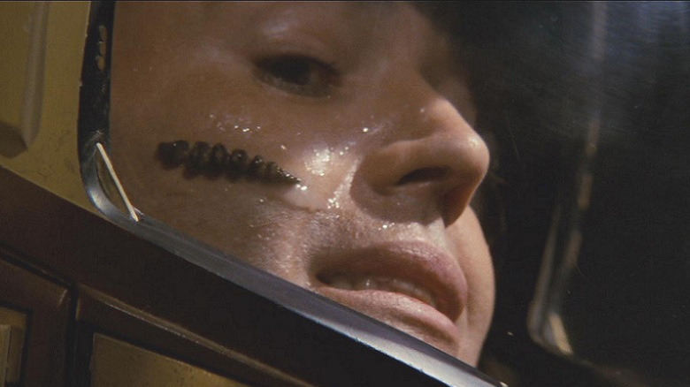 A Ceti eel crawls over Chekov's face