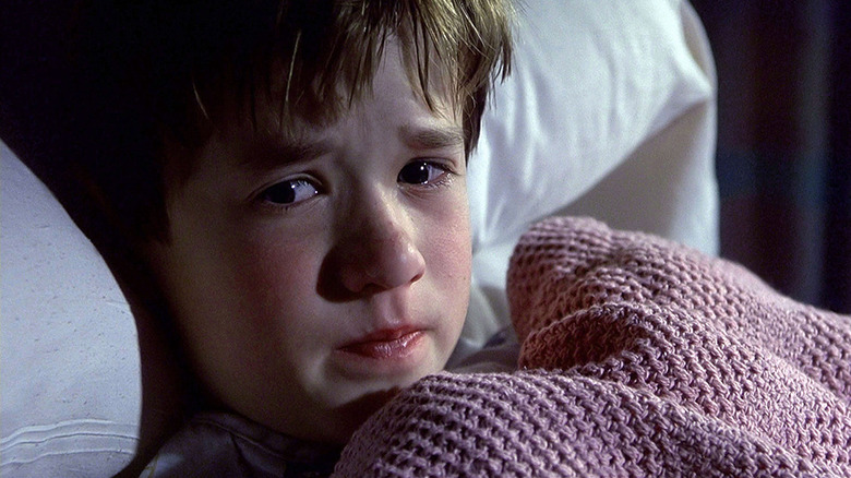 Haley Joel Osment Sixth Sense hides under blanket