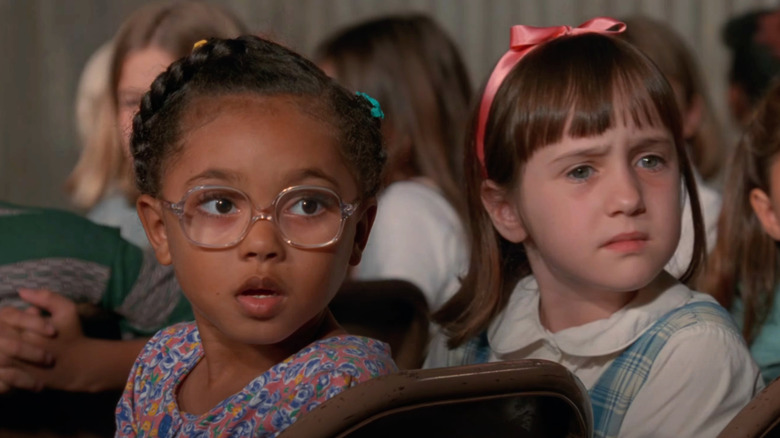 Kiami Davael as Lavender sits next to Mara Wilson's Matilda in Matilda