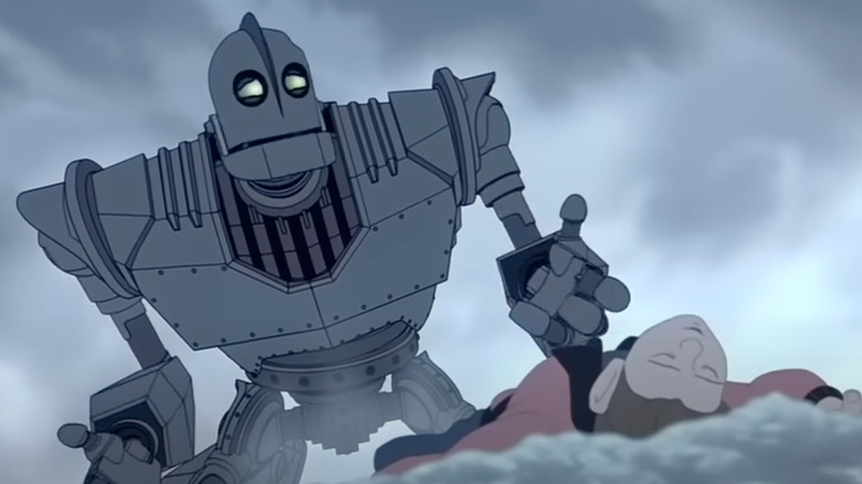 Vin Diesel as the Iron Giant weeps over Eli Marienthal as Hogart's body in The Iron Giant