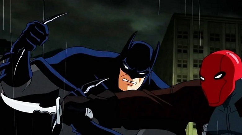 Batman fights Red Hood with batarang and blade in the rain