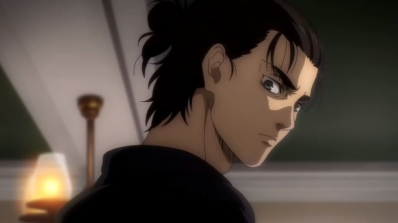 Eren looks over his shoulder in Attack on Titan