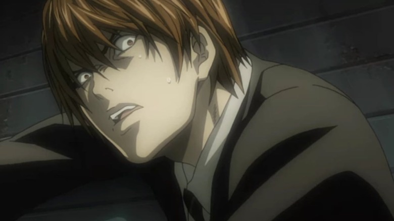 Light Yagami looks up in shock in Death Note