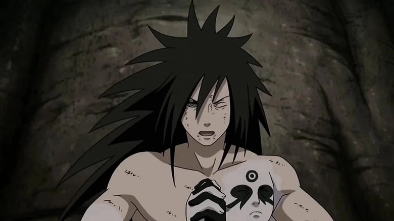 A shirtless Madara rests against a wall in Naruto Shippuden