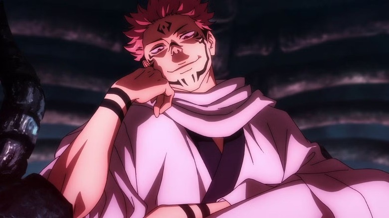 Sukuna rests his head on his fist in Jujutsu Kaisen