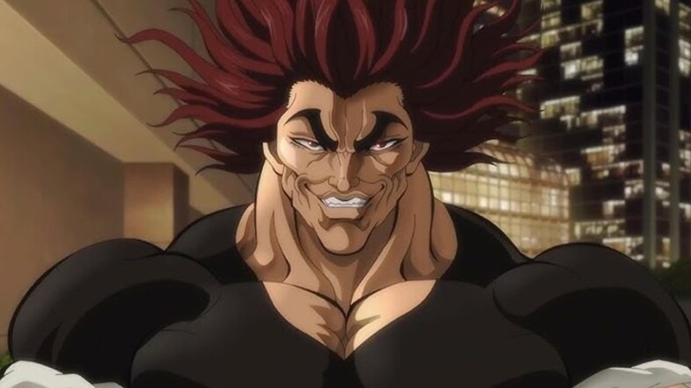 Yujiro grins while powering up in Baki