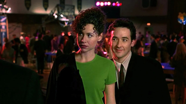 Minnie Driver and John Cusack as Martin and Debi, attending the reunion in Grosse Pointe Blank