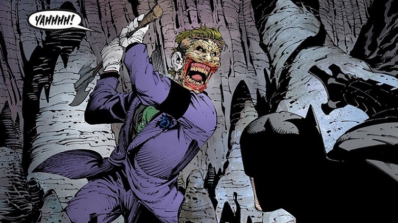The Joker attacks Batman with an axe, screaming.