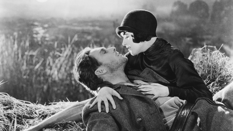 The Man (George O'Brien) cradled by the Woman from the City (Margaret Livingston) in Sunrise