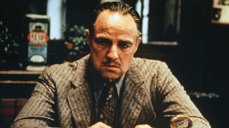 Don Vito Corleone (Marlon Brando) staring in The Godfather