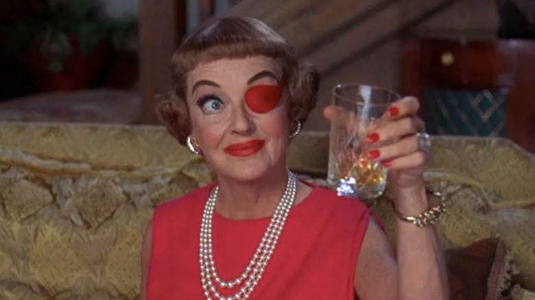 Bette Davis raising a glass