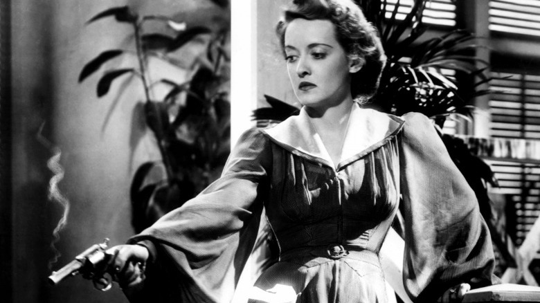 Bette Davis holding gun