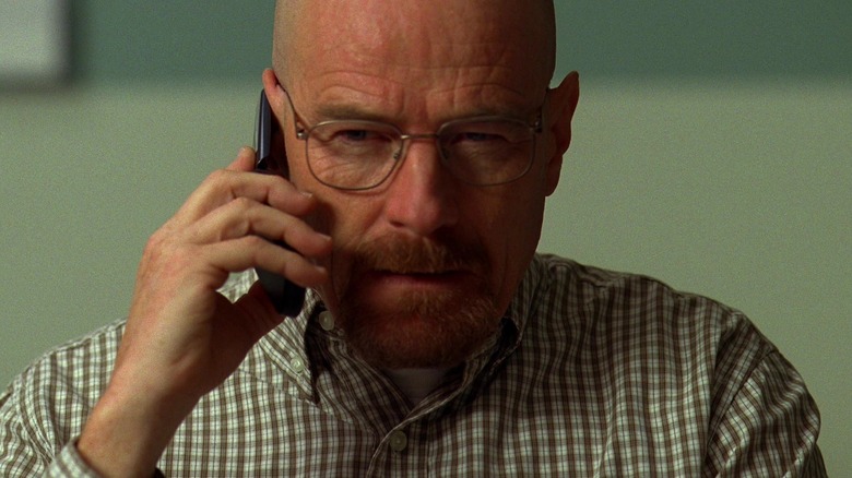 Bryan Cranston as Walter White holding a phone to his ear in Breaking Bad