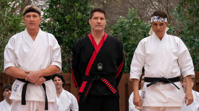 William Zabka's Johnny Lawrence and Ralph Macchio's Daniel LaRusso watch a fighting tournament in Cobra Kai