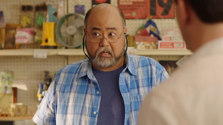 Paul Sun-Hyung Lee's Mr. Kim staring to the side in Kim's Convenience