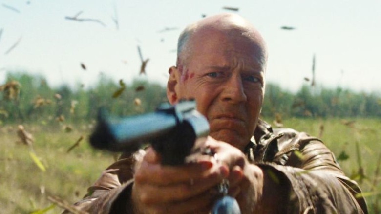 Bruce Willis pointing gun