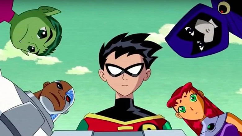 The Teen Titans looking at a console